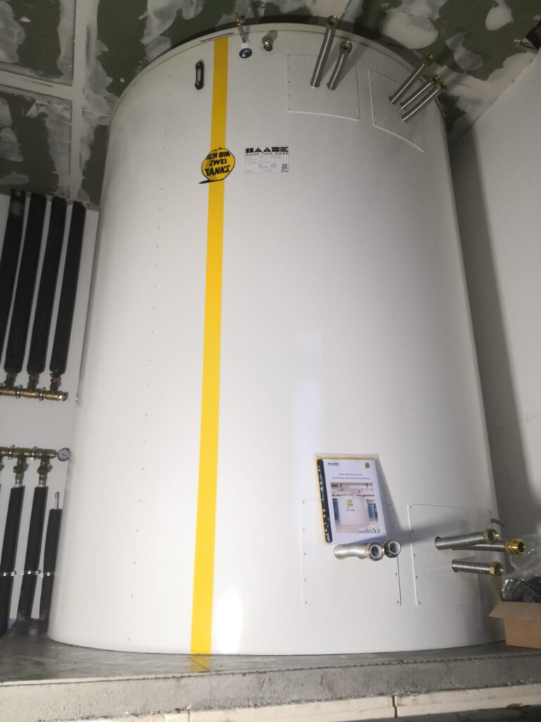 The hot water tank was installed in the plant room up to the ceiling.